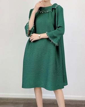 Pleated tunic with applique