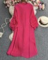 Pleated tunic with rosette