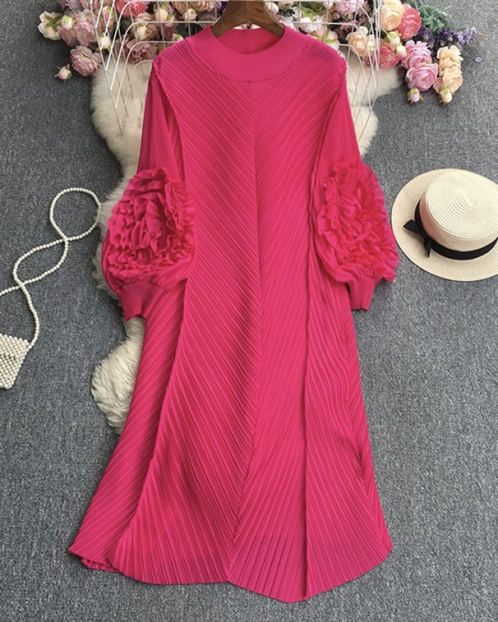 Pleated tunic with rosette