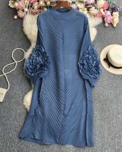 Pleated tunic with rosette