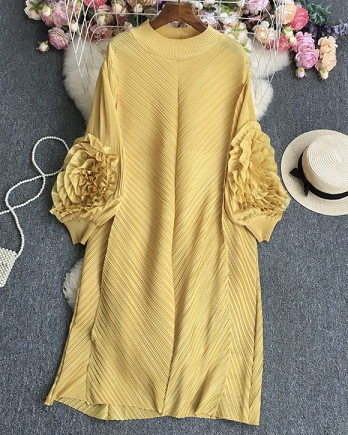 Pleated tunic with rosette