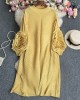 Pleated tunic with rosette
