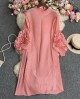 Pleated tunic with rosette