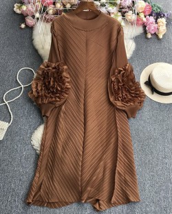 Pleated tunic with rosette