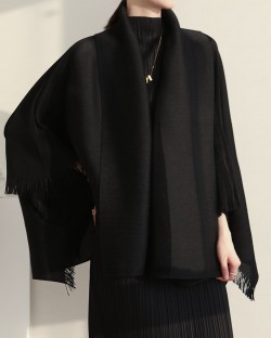 Pleated cape with tassel